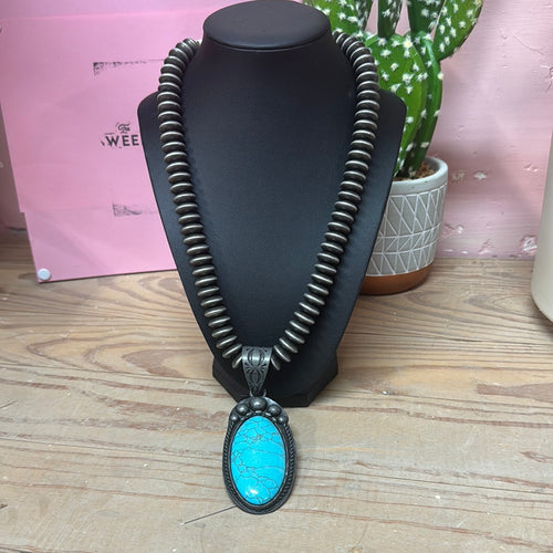 Faux turquoise pendent on navajo pearls necklace